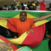 Ethiopia fan, Seife Tesfemariam, 26, of Denver, holds up a Ethiopian flag as he and others celebrate the men's Team Ethiopia victory in the 27th Annual Bolder Boulder held in Boulder, Colo., on Monday, May 30, 2005.