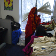 Denver, Colo. shot on 3/9/05 Zahara Omar, 22 looks out on the streets of Denver.  There is snow outside and she will make use of the donation at the ACC to keep warm. 