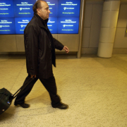 Ahmad Dizayee  of Lakewood Colorado changes planes Friday night in Seattle on his way to San Diego to stay with friends there to vote in the Iraq elections in Irvine, California on Saturday. 