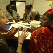 Denver, Colo. shot on 3/9/05) Amy McGuire, is a DU graduate  student who comes to the ACC to help refugees like Zahara Omar, 22 (far r) learn English and the finesse of filling out a job application. 