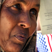 Saharo Abdulle, who hails from Somalia, joins close to 600 other immigrants for a naturalization ceremony in Civic Center Park's Greek Amphitheater in Denver, Colo., on Tuesday.
