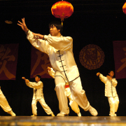 Michael Murry, center, leads a group through an exhibition of Chinese GongFu on Sunday afternoon at George Washington High School in Denver. The group from the Denver Chinese School was taking part in the Colorado Asian Pacific Spring Festival Chinese New Year Celebration. The festival also included children's games and food - all in honor of lunar year 4074. 6A