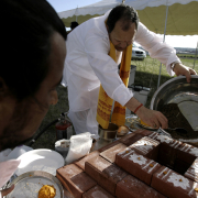 Acharya (priest) Kailash Chandra Upadhyay pours dirt into a sacramental offering while Pundit Rauhavendra(cq) paints the outer edges before the start of the Pooja ceremony in the Dove Valley area of Centennial, Colo on Saturday, June 23, 2007. The Hindu T