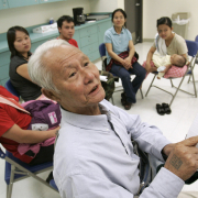 Hline Pyu, 72, a Burmese refugee, talks about the one and only time he voted in the 1950's in Burma, as a group of refugees learn about the U.S. election system at the voting center at Montclair Recreation Center in Denver, Colo., on Friday,