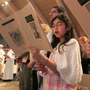 Natalie Homsi joins her congregation in prayer during the Dedication and Consecration ceremonies at St. Rafka Maronite Church in Lakewood, CO Sunday March 18, 2007.A local congregation of Middle Eastern Christian immigrants -- from Iraq, Syria, Lebanon