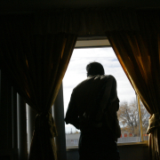 Iraqi refugee Jaafar Al Saad looks out of the window of his Denver apartment 11/7/2008 where he and his family have lived for the four months they have been in Denver.  They were refugees living in Jordan and were resettled in Denver
