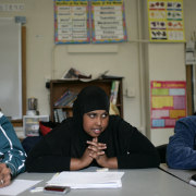 Iraqi refugee Jaafar Al Saad, left,  Somali refugee (unknown) and Bhutanese refugee XXX, listen to their classmates' talk about their English As A Second Language assignment in class at the Emily Griffith Opportunity School.  (JUDY DEHAAS/ROCKY MOUNTAIN NEWS) 