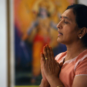 Woman prays in Hindu temple