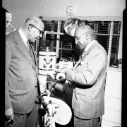 Dr. Hawkins (left) and Clarence Holmes' (right) in Holmes' dentist office
