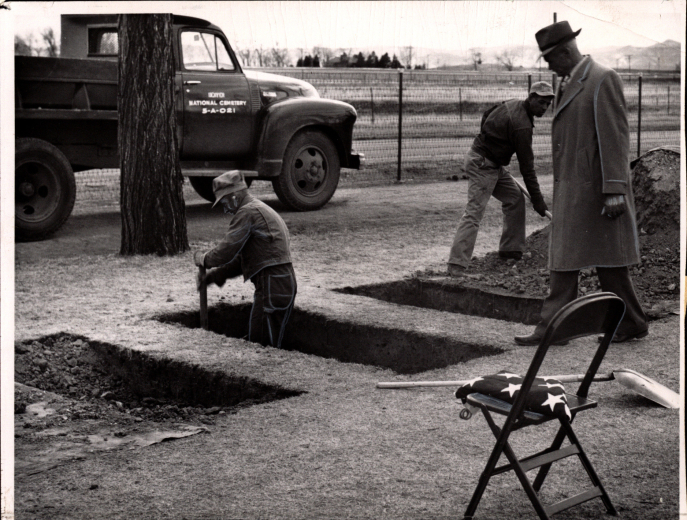 April 4, 1952: Gravediggers throw the final shovels of dirt in the graves of three World War II soldiers who died in a Japanese prison camp. RMN PhBx409 Fort Logan