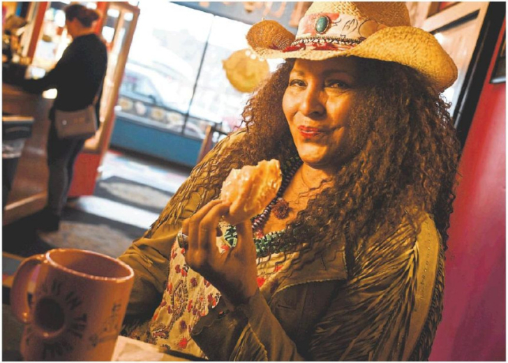 Pam Grier enjoying Voodoo Donuts