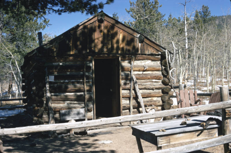 View of the Enos Mills Cabin located on Colorado Highway7, 9 miles south of Estes Park, Larimer County, Colo.  Built in 1885, the simple one-story cabin of chinked, notched logs has a framed cutout for the front door in its facade.  The cabin in on the National Register.  Enos Abijah Mills (1870-1922) was an American naturalist and homesteader. He was the main figure behind the creation of nearby Rocky Mountain National Park.