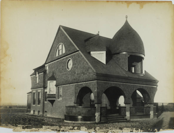 Presentation view of the A. W. Powell residence at 4451 Wolff Street in Berkeley (now Denver) Colorado; architectural features include shingle imbrication, round windows, bays, arches, a covered porch, and an onion dome.