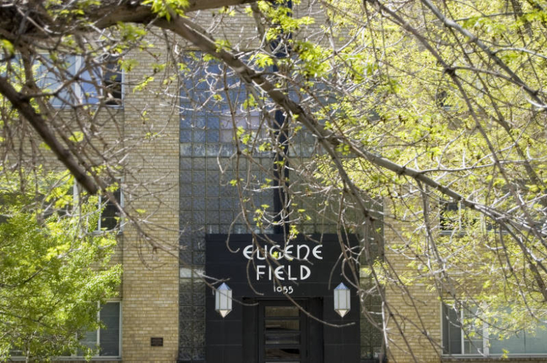 Entrance to the Eugene Field Building with tree in front