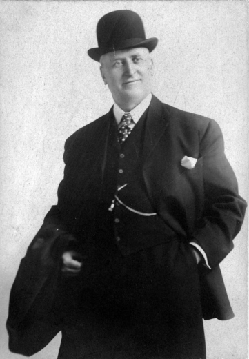 Portrait of James Joseph "J. J." Brown, Margaret "Molly" Brown's husband. He wears a suit, tie, and bowler hat.