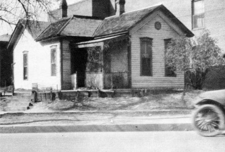 View of the Eugene Field residence that later became the Eugene Field branch of the Denver Public Library, Denver, Colorado. Prior to its being moved to accommodate the library, it was here at 307 West Colfax Avenue.