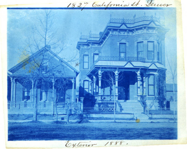 View of houses at 1827 California Street in Denver, Colorado. One of the houses, a two story brick building, has a covered porch and decorative trim.
