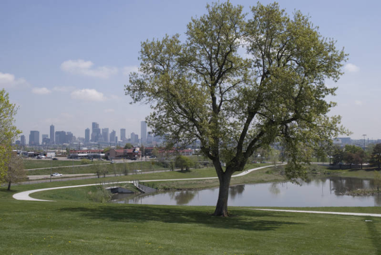 Barnum Dog Park with Barnum Lake and Downtown Denver in Background