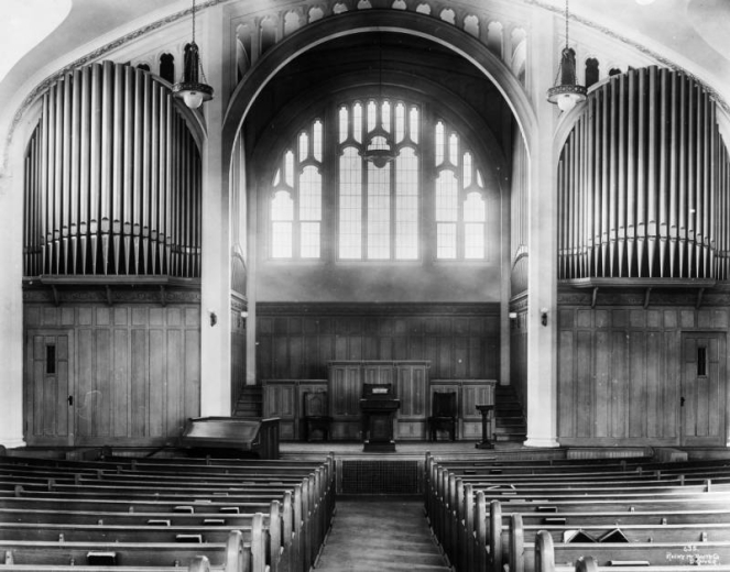 Interior view of the Montview Boulevard Presbyterian Church at 1980 Dahlia Street in the South Park Hill neighborhood of Denver, Colorado. Pews, organ pipes, a piano, and altar are in the church.