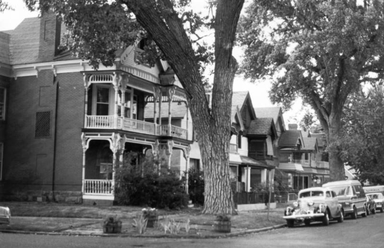 View of houses in the Potter-Highlands Historic District at 34th (Thirty-fourth) and Bryant Streets in Denver, Colorado; also shows parked cars.