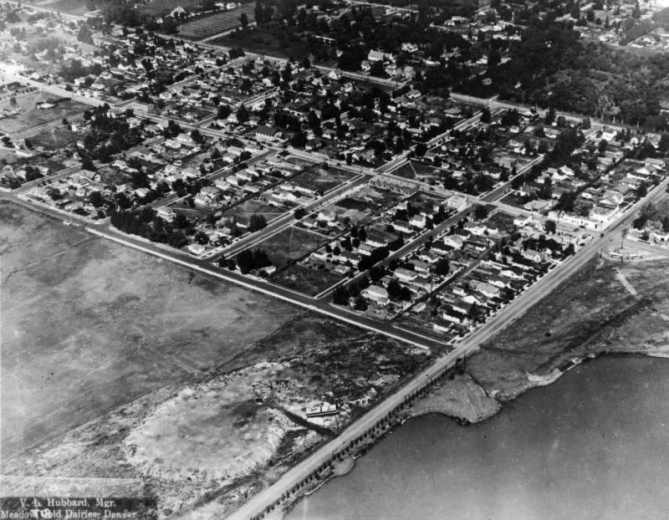 An aerial view of Edgewater, Jefferson County, Colorado, shows the town between 24th and 26th Avenues, at right angles to Sheridan Boulevard, with Sloan (Sloan's) Lake on the other side of Sheridan from the town.