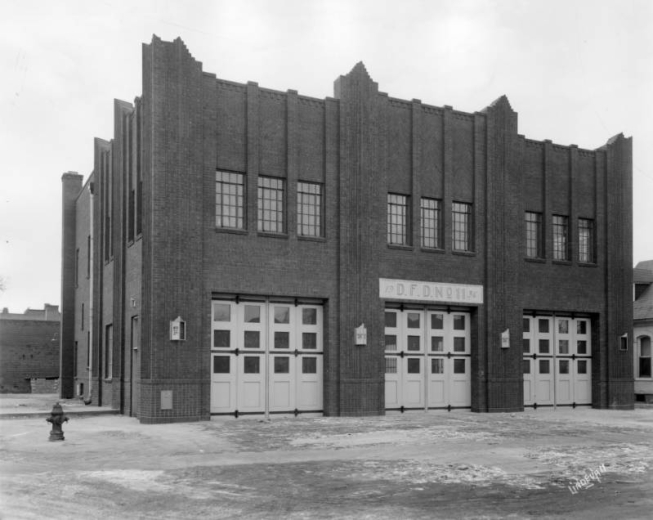 View of Denver Fire Department Station No. 11 at 40 West 2nd (Second) Avenue and Cherokee Street in the Baker neighborhood of Denver, Colorado. The art deco style building has corbeled brick. Letters read: "D.F.D. No. 11."