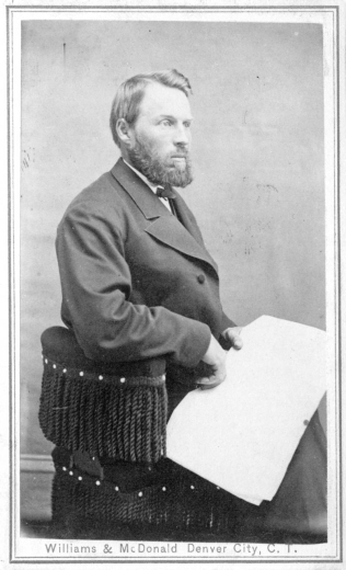 A portrait of William Newton Byers, Denver journalist, founder of Rocky Mountain News, civic leader, president of Festival of Mountain and Plain, and postmaster. He sits on a chair with tassels and holds a paper.