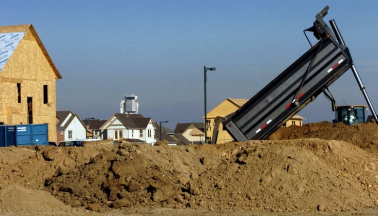 Stapleton was once an airport but now is the largest infill development in the US. The old Stapleton control tower (center, behind house) is all that remains of the airport. Rocky Mountain News 2004