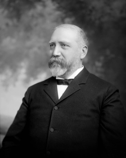 Studio portrait, head and shoulders, of Dennis Sheedy, Denver businessman; president of Denver Dry Goods Company; vice president of Colorado National Bank.