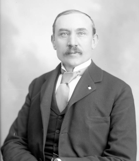 Studio portrait, head and shoulders, of Dr. James Hutchins Baker, president emeritus of the University of Colorado (1892-1913); principal of East High School; first president of Colorado State Teachers Association; president of National Council of Education; president of National Association of State Universities.