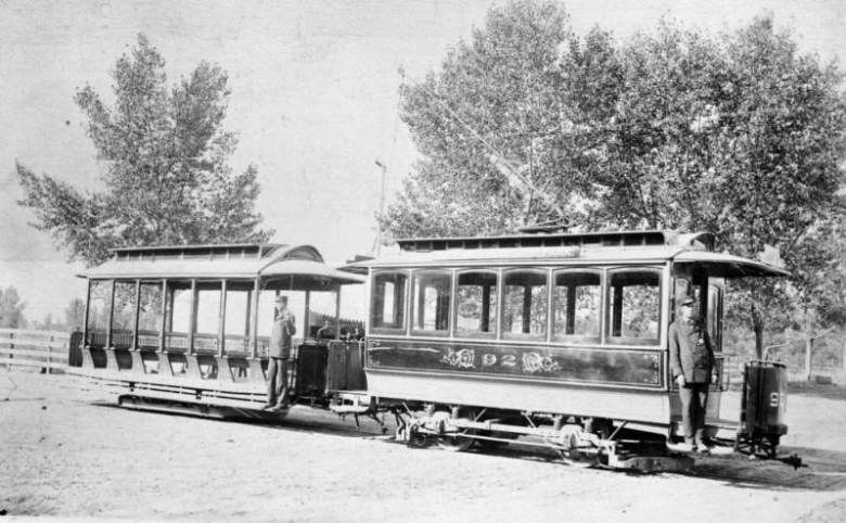 A conductor and a grip man stand on cable car No. 92 of the Denver Tramway Company in Denver, Colorado. In 1871, the Denver Horse Railroad Company began operating the city's first horse-car line from 7th and Larimer streets to 27th and Champa streets. By the mid-1880s, the horse-drawn cars were being replaced by cable cars such as the one shown here. By the 1890s, electric trolley systems had been refined enough to replace the cable cars.