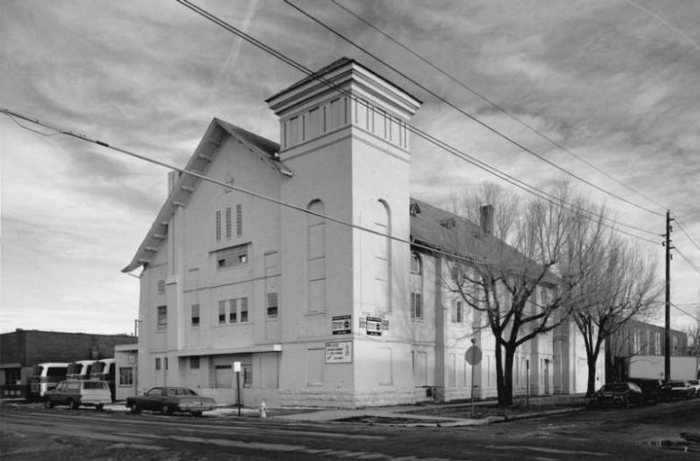 View of Congregation Emanuel at 2400 Curtis Street (at 24th - twenty fourth)  in the Curtis Park Neighborhood of Denver, Colorado; features include a square tower, blind arches, glass brick, a crown ornament, arched windows and a gabled roof and dormers.