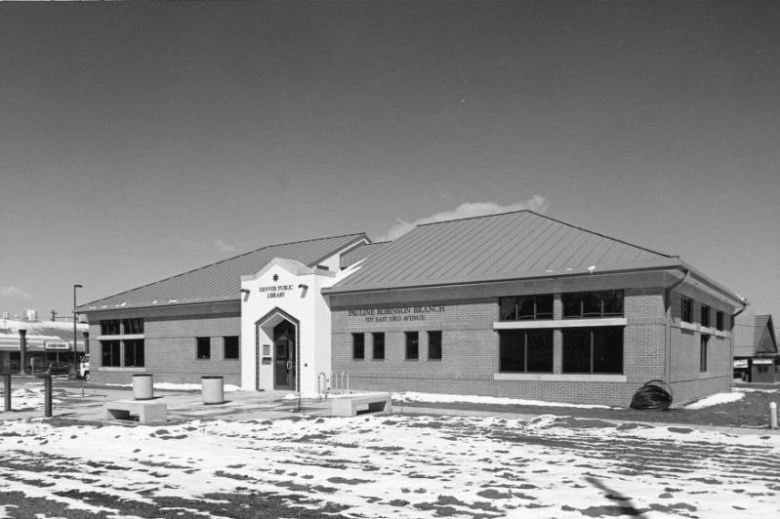 View of the Pauline Robinson Branch of the Denver Public Library, at 5575 East 33th (Thirty third) Avenue at Holly Street in the North Park Hill Neighborhood of Denver, Colorado. The brick building has stone trim and an arched entry and a pediment.