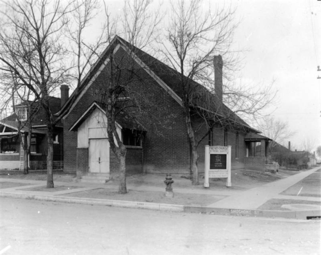 View of the North Denver Friends Church at 41st (Forty-first) Avenue and Shoshone Street in the Sunnyside neighborhood of Denver, Colorado. The brick building has a chimney, covered entryway, and sign nearby.