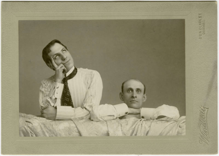 Studio portrait of actor Francis Wilson and Eugene Field, journalist and poet. The two men mug for the camera. Wilson rests his face on his hand and looks upward.