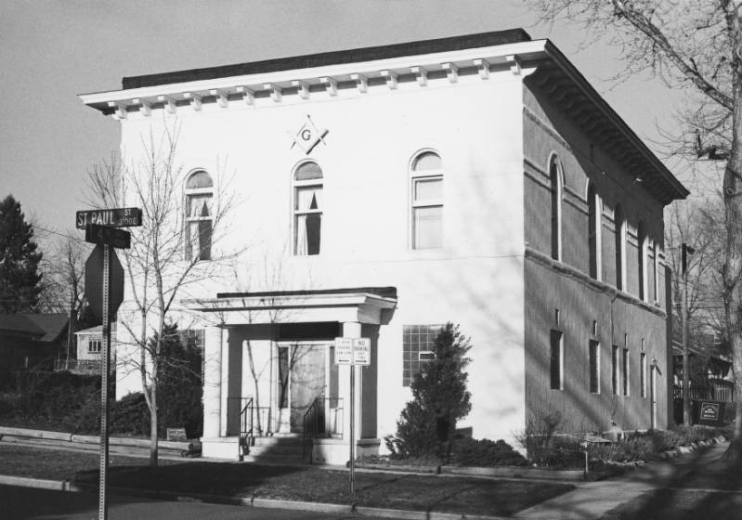 View of the Harman Town Hall / Greenleaf Masonic Temple (1891: Franklin E. Kidder and Ida Humphreys,architects), 400 Saint Paul Street in the Cherry Creek Neighborhood, Denver, Colorado. The eclectic style building has round-arched second story windows, a bracketed cornice and a front porch supported by round pillars. A masonic crest is mounted on the front of the building. The building is a Denver Landmark.