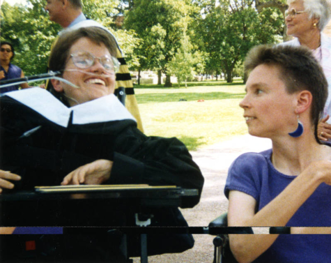 Laura Hershey at Colorado College (Colorado Springs, Colorado) where she received an Honorary Doctorate in Humane Letters in 1992. Robin Stephens is on Laura's left. Photographer unknown.