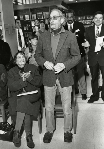Surrounded by local luminaries, the architect of the original Ross Branch Library in 1951, Victor Hornbein, gives a talk at the rededication ceremony in January, 1995