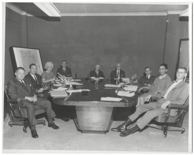 Group photograph of the Denver Public School board of Education from May 1965 to May 1867.  From left to right are: John H Amesse, M.D.; James D. Voorhees, Jr.; Mrs. Allegra Saunders; Kenneth R. Gher,  Secretary; Palmer L. Burch,  President; Dr. Kenneth e. Oberholtzer, Superintendent; A. Edgar Benton, Vice-President; Mrs. Rachel B. Noel; and Jackson F. Fuller.