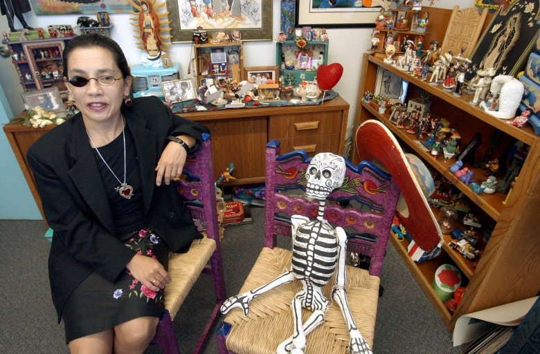 Florence Hernandez-Ramos keeps multicultural shrine at office.  Mexican folk art fills every surface of Florence Hernandez-Ramos's office. 