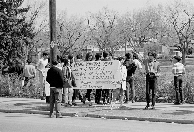 West High School Walkout Crowd with sign walking downtown