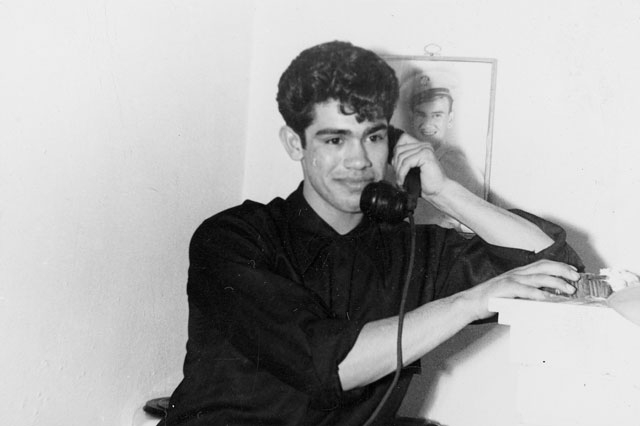 Rodolfo "Corky" Gonzales talks on the telephone