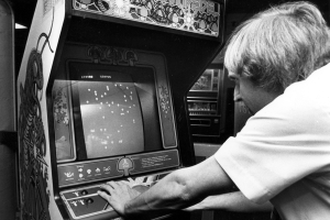 Player Bill Saling fights waves of attackers on the video game Centipede