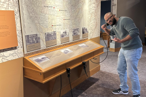 Museum Services Manager Dexter Nelson II with some of the technology being updated.