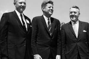 Governor Stephen McNichols, President John F. Kennedy, and U. S. Senator John Carroll pose outdoors at the Pueblo Public School Stadium in Pueblo