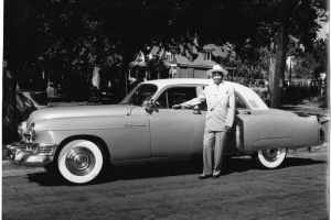 Otha Rice standing by Cadillac.