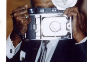 Dr. Clarence Holmes with camera