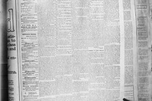 Shows a copy of the April 23, 1859 Rocky Mountain News, Vol.1, No.1, it's first edition. The paper is staged and clipped on a board for the photo. Under the banner "The Mines And Miners Of Nebraska;" headlines read: "The Opening Of Japan," "Alphabetical Conundrums," "The World Without A Sabbath," "Communications Received By The Nebraska Immigration Society," "Yankee Visit To Carlyle."