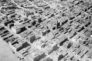 A photograph of a photo of an aerial view of downtown Denver. The Daniels and Fisher tower is in the middle of the photo.