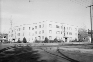 Brick, three story, apartment building at the corner of 21st and Franklin Streets in the Five Points neighborhood of Denver, Colorado.
